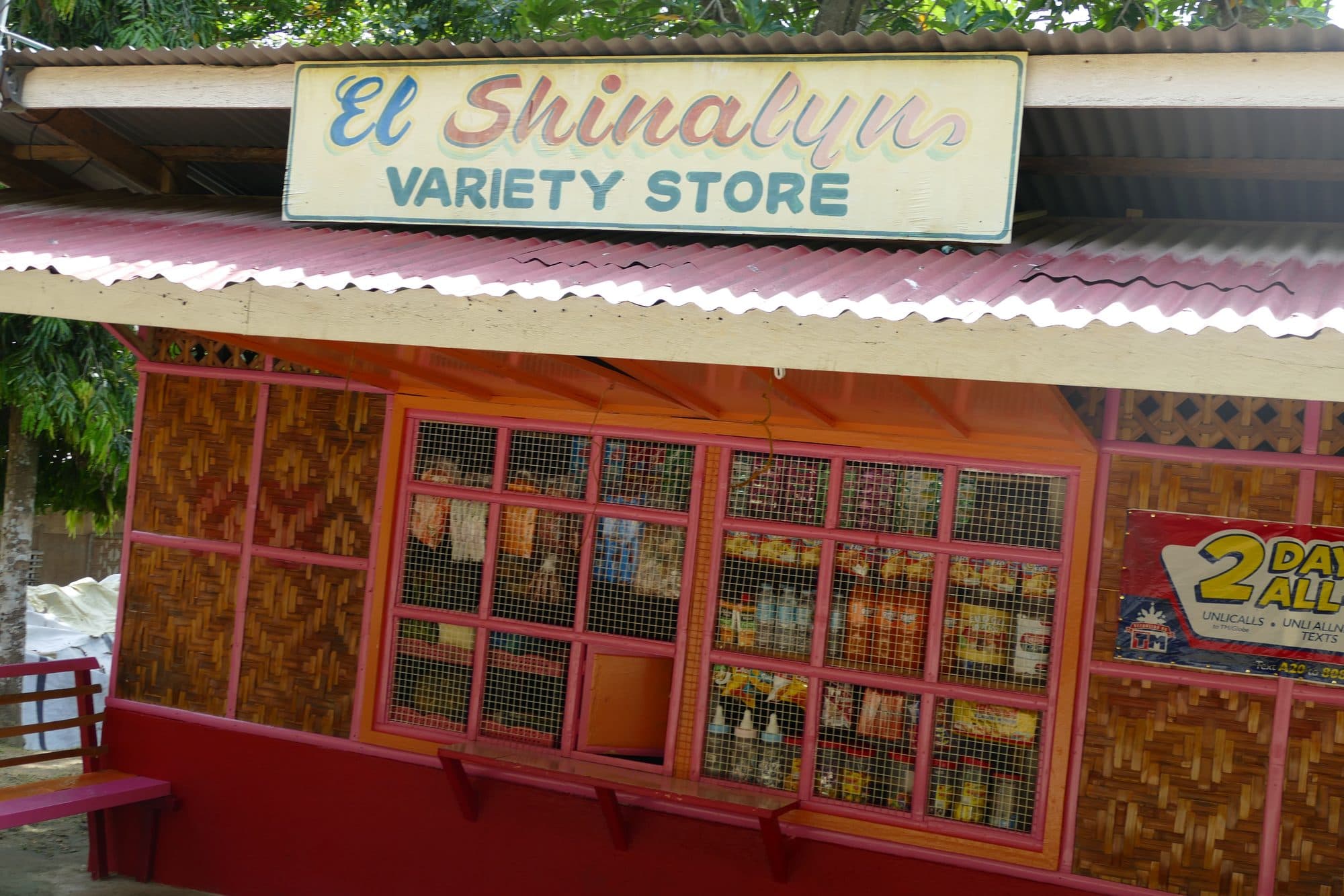 A brightly painted sari-sari variety store